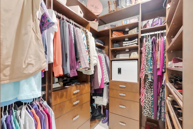 a living room with furniture a large window with outer view