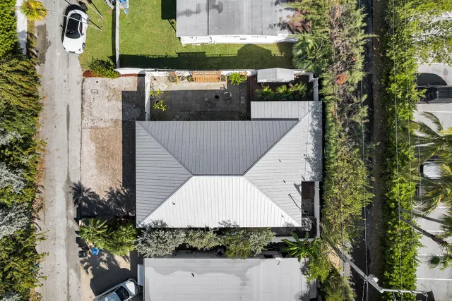 an aerial view of a house with a garden
