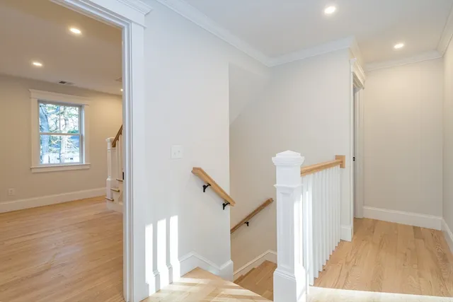 a view of an entryway with wooden floor