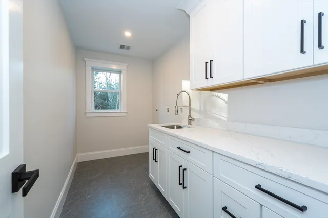 a bathroom with a sink and a window