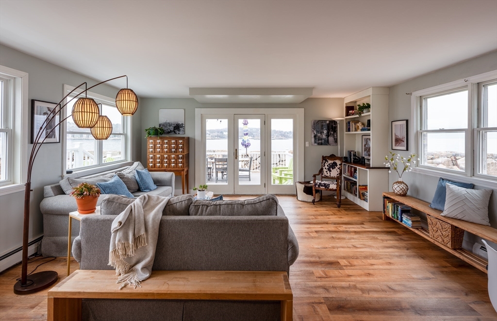 4 N Road, Unit 2 Rockport, MA 01966 - Photo 11 of 21 a living room with furniture fireplace and a large window