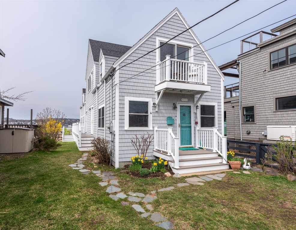 4 N Road, Unit 2 Rockport, MA 01966 - Photo 4 of 21 a front view of a house with garden