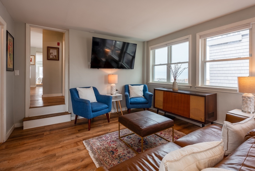 4 N Road, Unit 2 Rockport, MA 01966 - Photo 6 of 21 a living room with furniture a flat screen tv and a window
