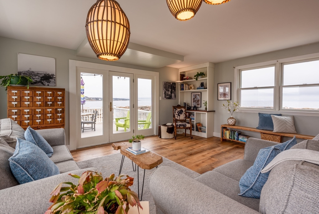 4 N Road, Unit 2 Rockport, MA 01966 - Photo 10 of 21 a living room with furniture two window and a flat screen tv