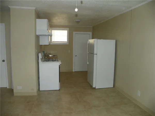 a view of kitchen and utility room