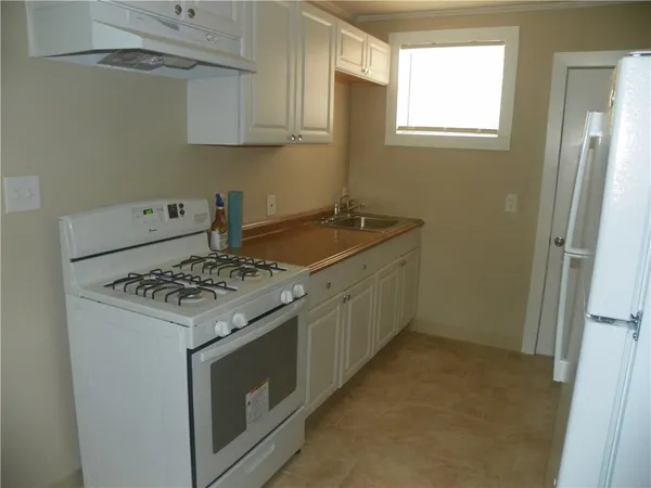 a kitchen with a stove and a sink