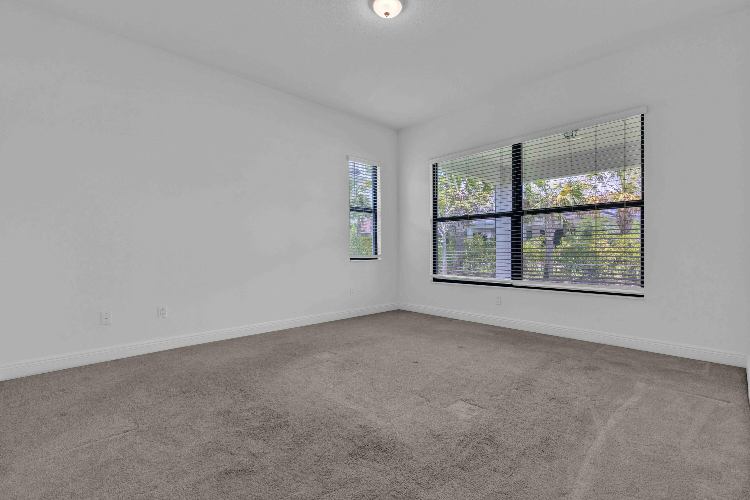 5501 Santa Rosa Lane Westlake, FL 33470 - Photo 17 of 31 an empty room with windows