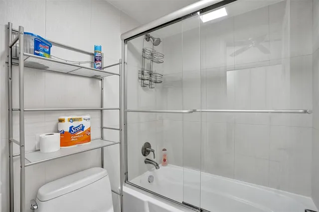 a bathroom with a shower and a sink