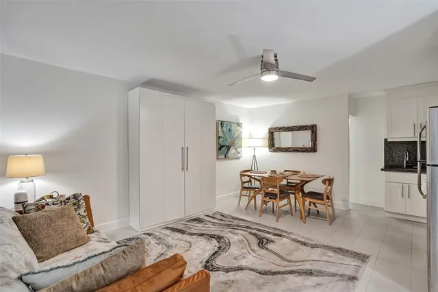 a bedroom with furniture and a flat screen tv