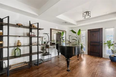 a view of a livingroom with furniture and hardwood floor