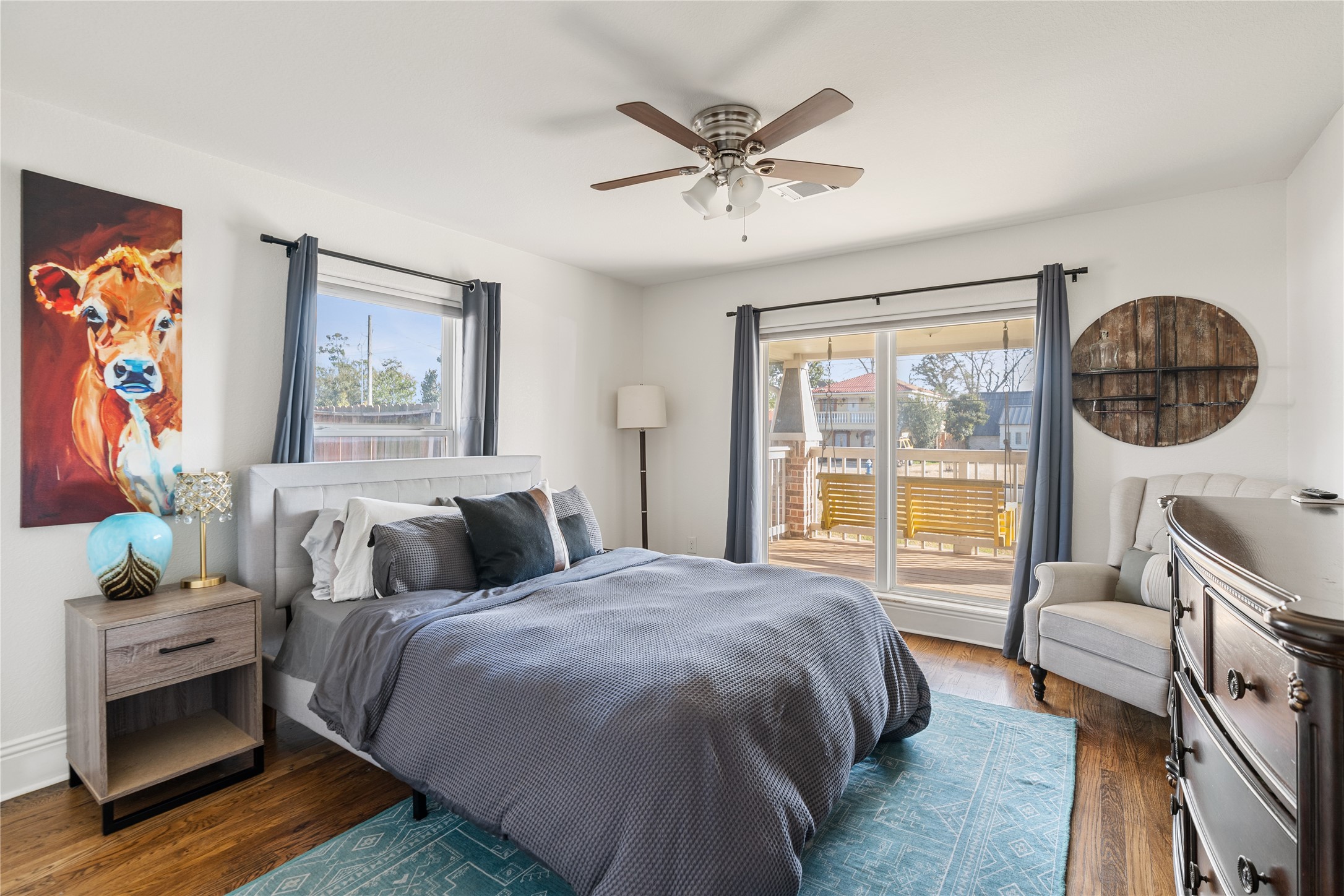 4522 Randwick Drive Houston, TX 77092 - Photo 22 of 32 a bedroom with a bed a couch and a window