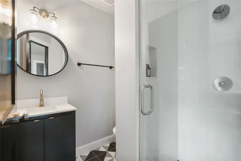 a bathroom with a sink and mirror
