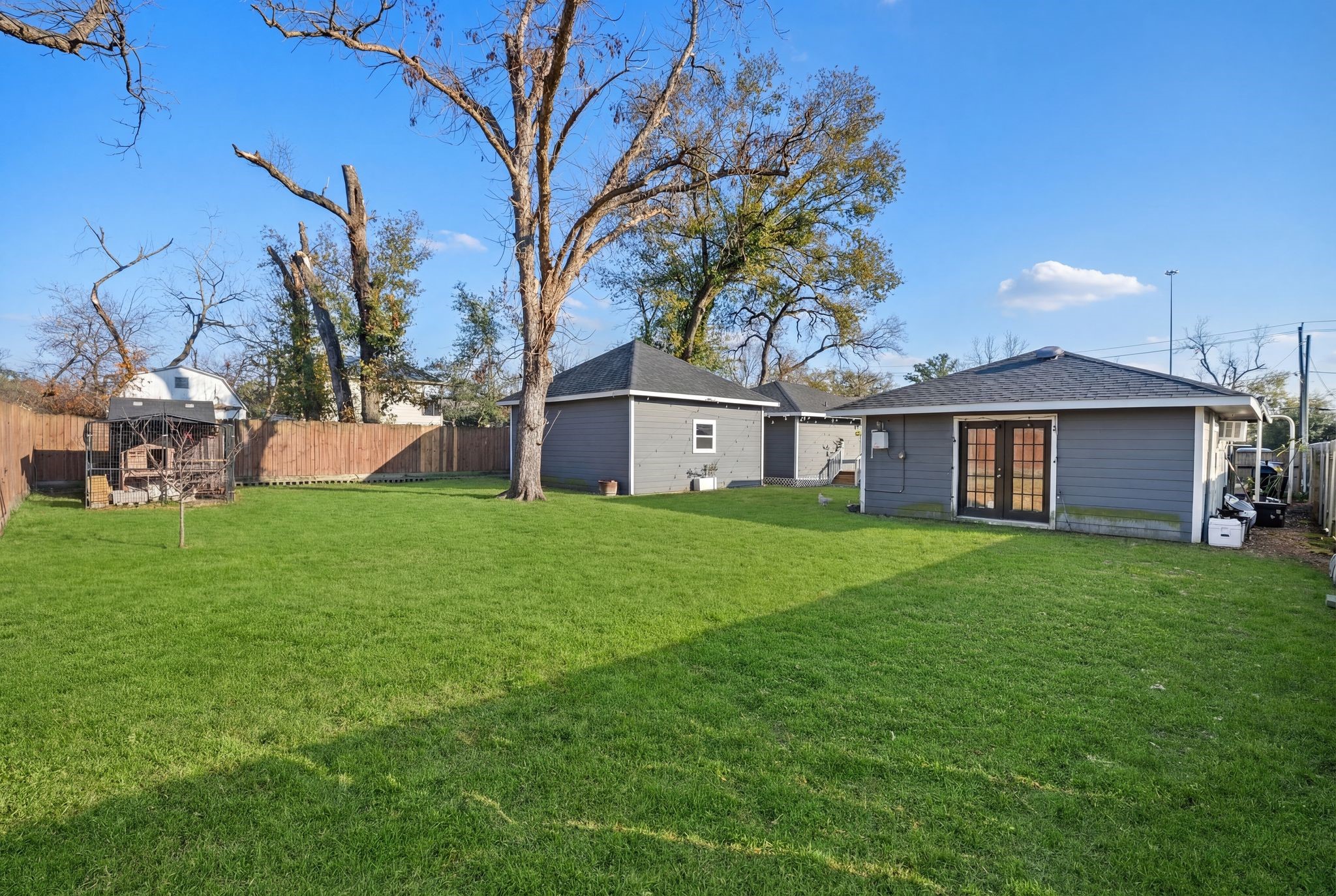 4522 Randwick Drive Houston, TX 77092 - Photo 30 of 31 The expansive fenced backyard offers ample room for a future pool, and the detached casita is already equipped with a full pool-ready bath.