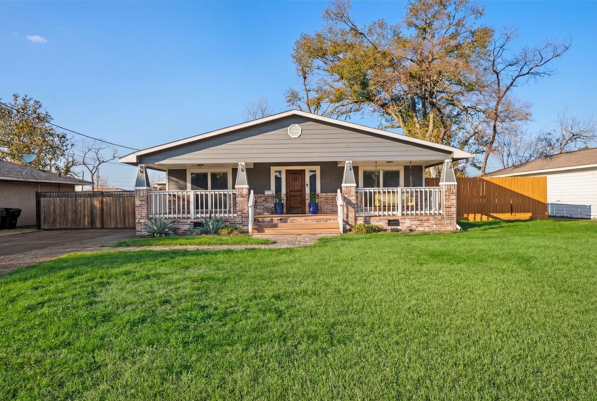 4522 Randwick Drive Houston, TX 77092 - Photo 32 of 32 a front view of a house with a yard table and chairs