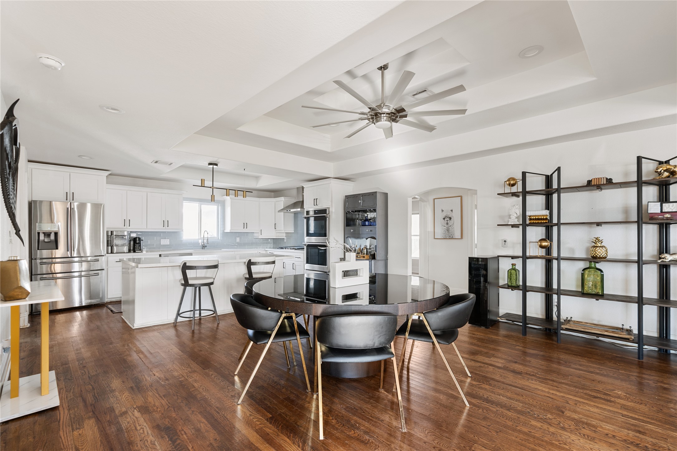 4522 Randwick Drive Houston, TX 77092 - Photo 9 of 31 Warm wood flooring and abundant natural light create an inviting everyday atmosphere.