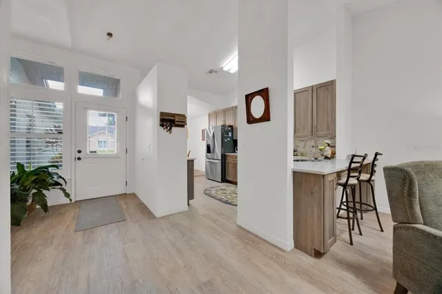a view of a livingroom with furniture and a kitchen