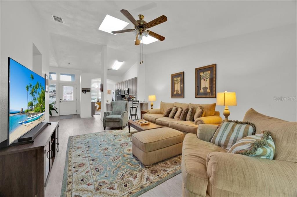 5734 Delano Lane Orlando, FL 32821 - Photo 13 of 28 a living room with furniture and a flat screen tv
