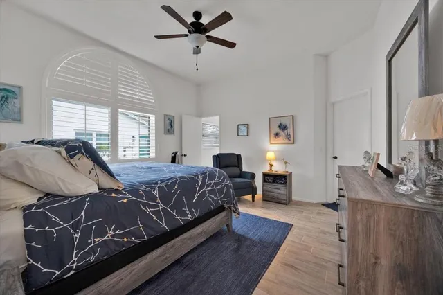 a bed room with a bed window and dresser