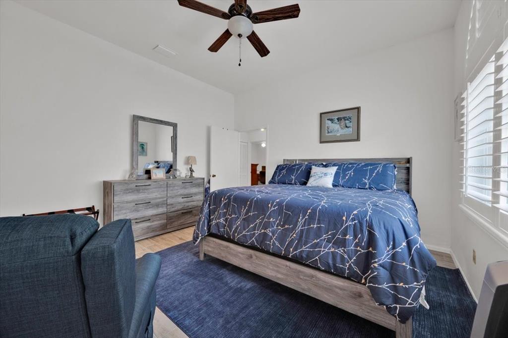 5734 Delano Lane Orlando, FL 32821 - Photo 19 of 28 a bedroom with a bed and window