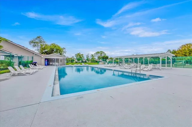 a view of a swimming pool and a yard