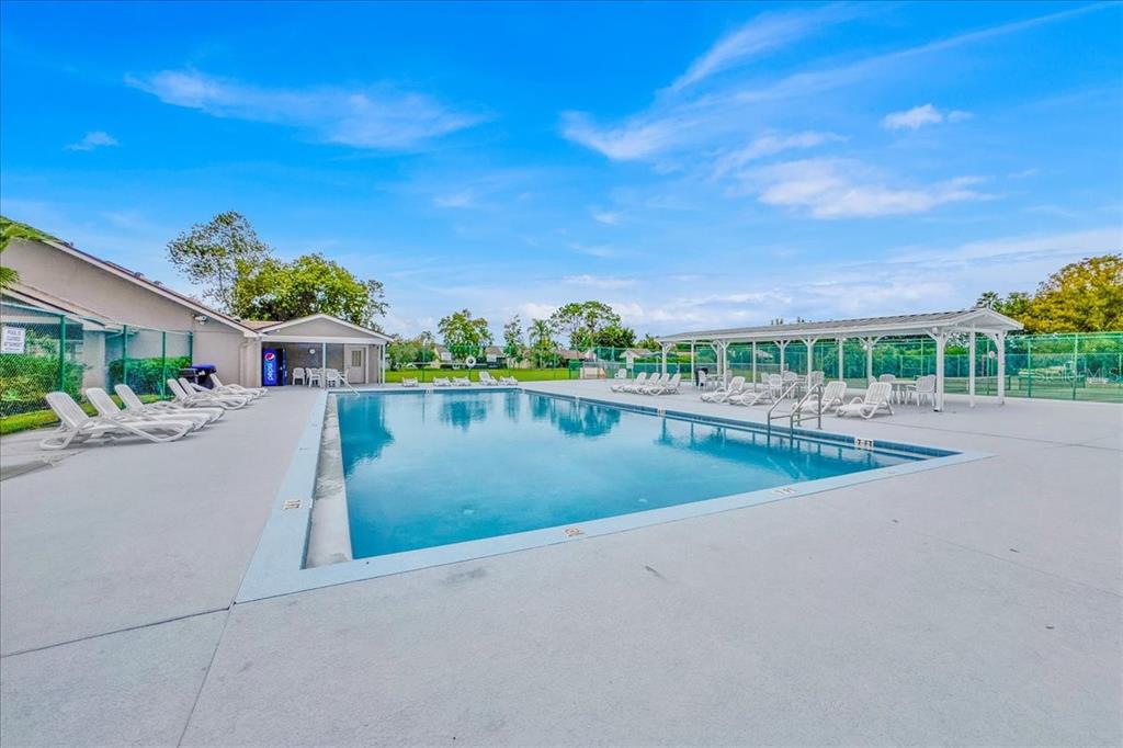 5734 Delano Lane Orlando, FL 32821 - Photo 25 of 28 a view of a swimming pool and a yard