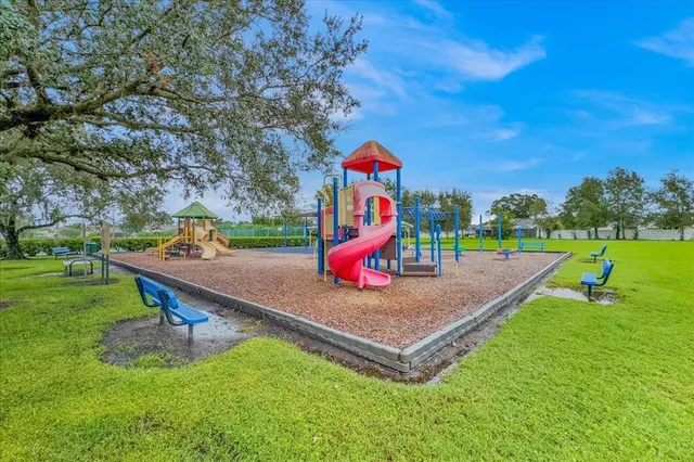 a view of a playground with basketball court