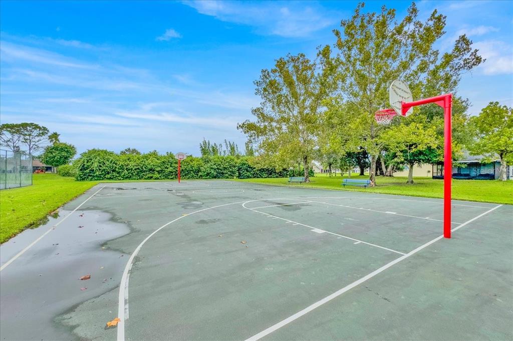 5734 Delano Lane Orlando, FL 32821 - Photo 27 of 28 a view of a playground with basketball court