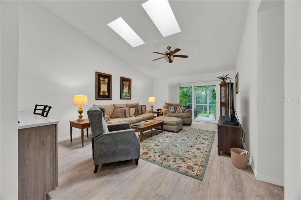 5734 Delano Lane Orlando, FL 32821 - Photo 10 of 28 a living room with furniture and wooden floor