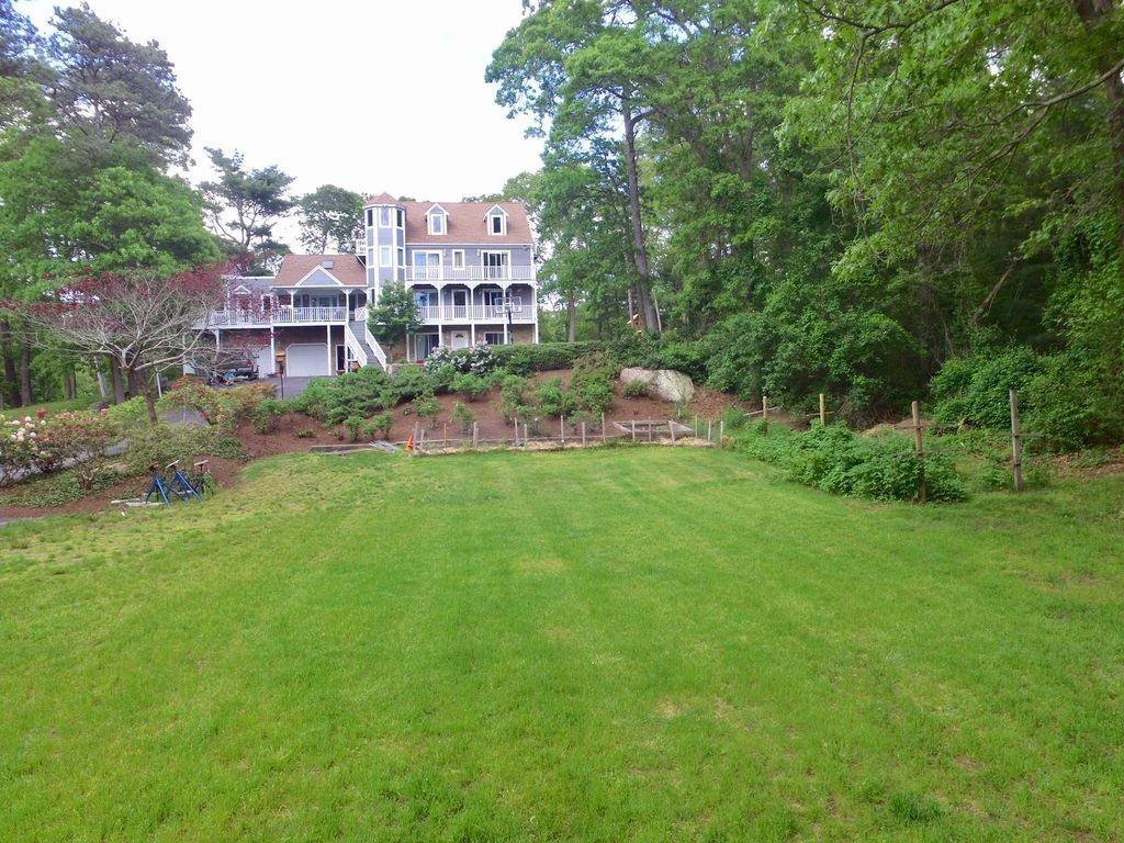a view of a building with a yard
