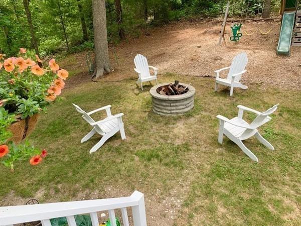171 County Road Bourne, MA 02532 - Photo 20 of 27 a backyard of a house with fire pit and outdoor seating
