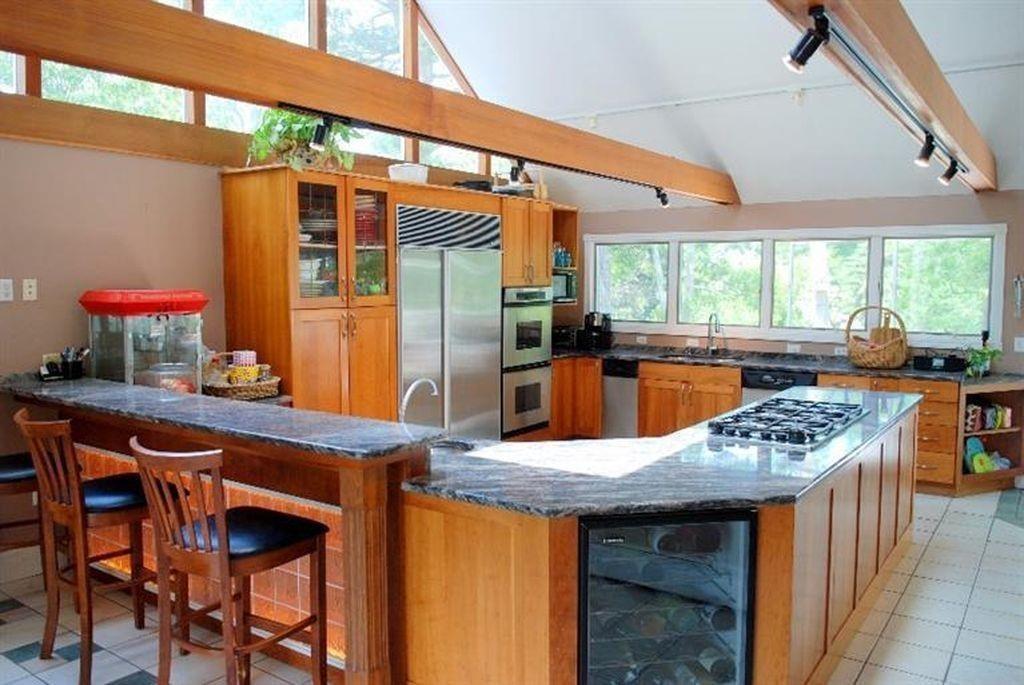 171 County Road Bourne, MA 02532 - Photo 2 of 27 a kitchen with stainless steel appliances granite countertop a sink a stove and chairs