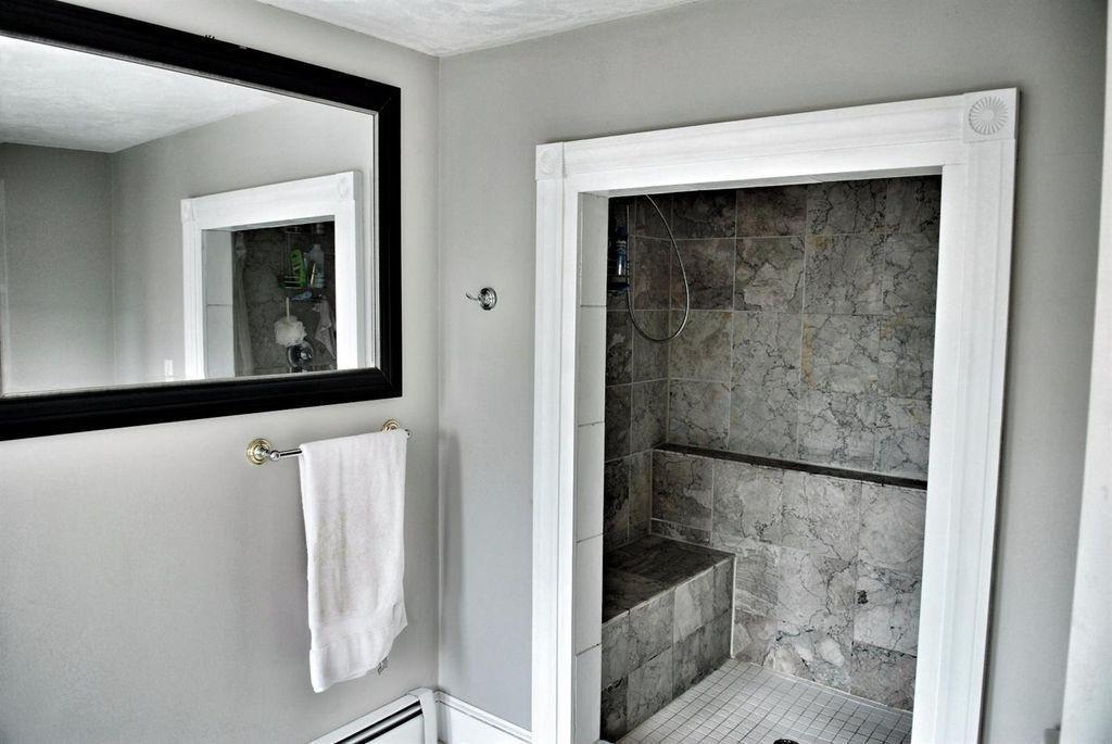 171 County Road Bourne, MA 02532 - Photo 8 of 27 a bathroom with a bathtub and a shower