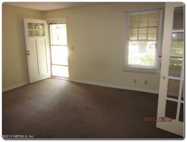 415 Duray Street Jacksonville, FL 32208 - Photo 10 of 25 a view of a livingroom with an empty space and a window