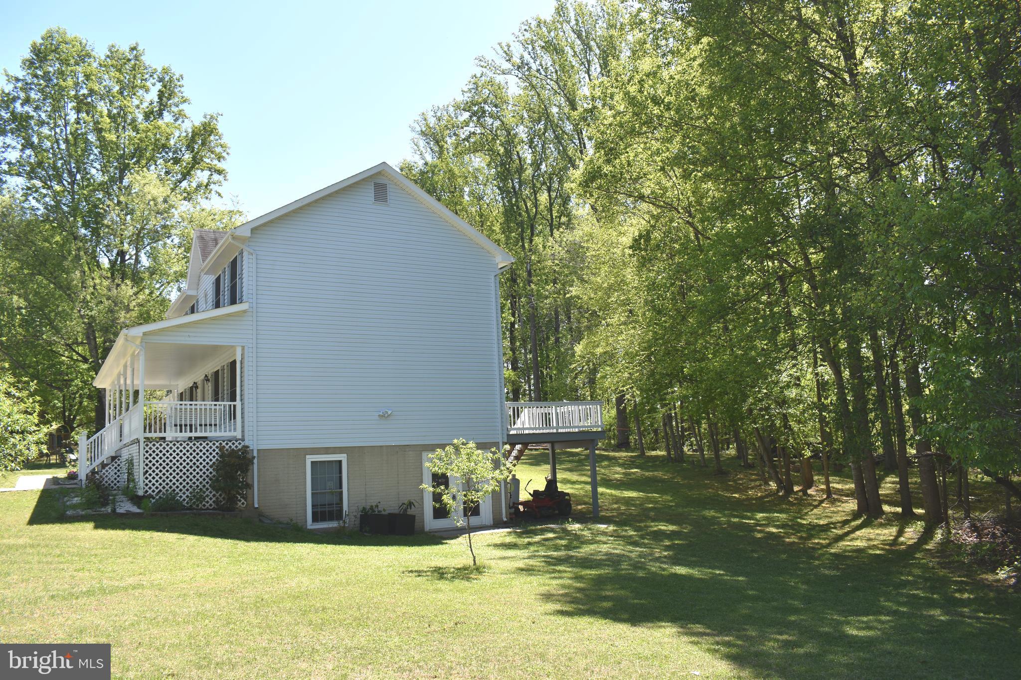 10958 Mountain Run Lake Road Culpeper, VA 22701 - Photo 29 of 31 a view of a house with a yard