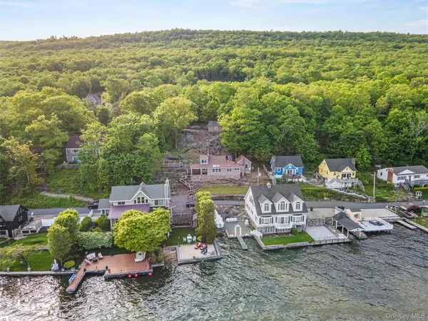a view of a lake with couches and city view