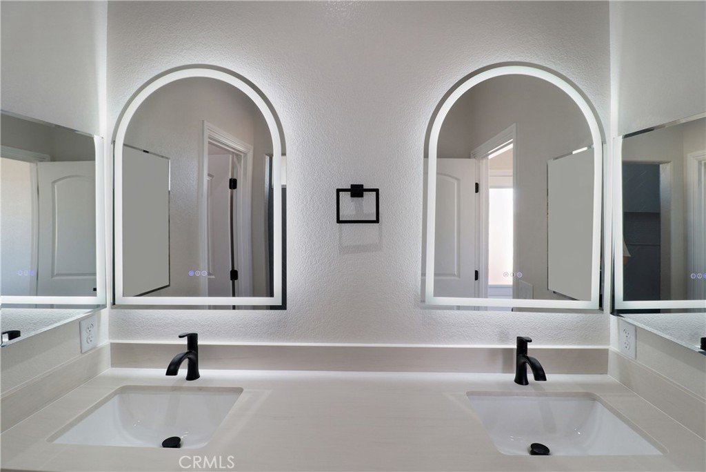 14785 Tigertail Road Apple Valley, CA 92307 - Photo 11 of 20 a bathroom with a sink and a mirror