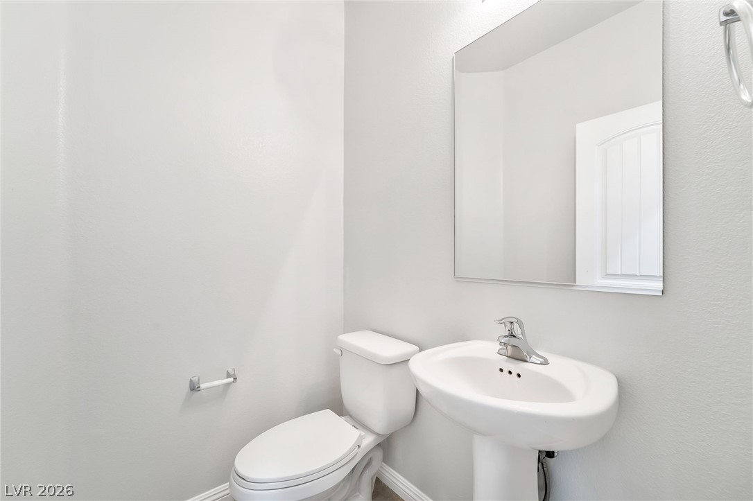 33 Jasmine Point Street Henderson, NV 89074 - Photo 12 of 36 Bathroom with toilet and baseboards