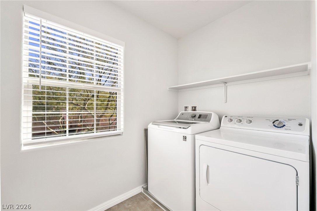 33 Jasmine Point Street Henderson, NV 89074 - Photo 15 of 36 Laundry area with baseboards and washing machine and clothes dryer