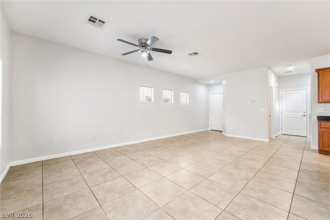 33 Jasmine Point Street Henderson, NV 89074 - Photo 4 of 36 Empty room featuring a ceiling fan, light tile patterned flooring, and recessed lighting