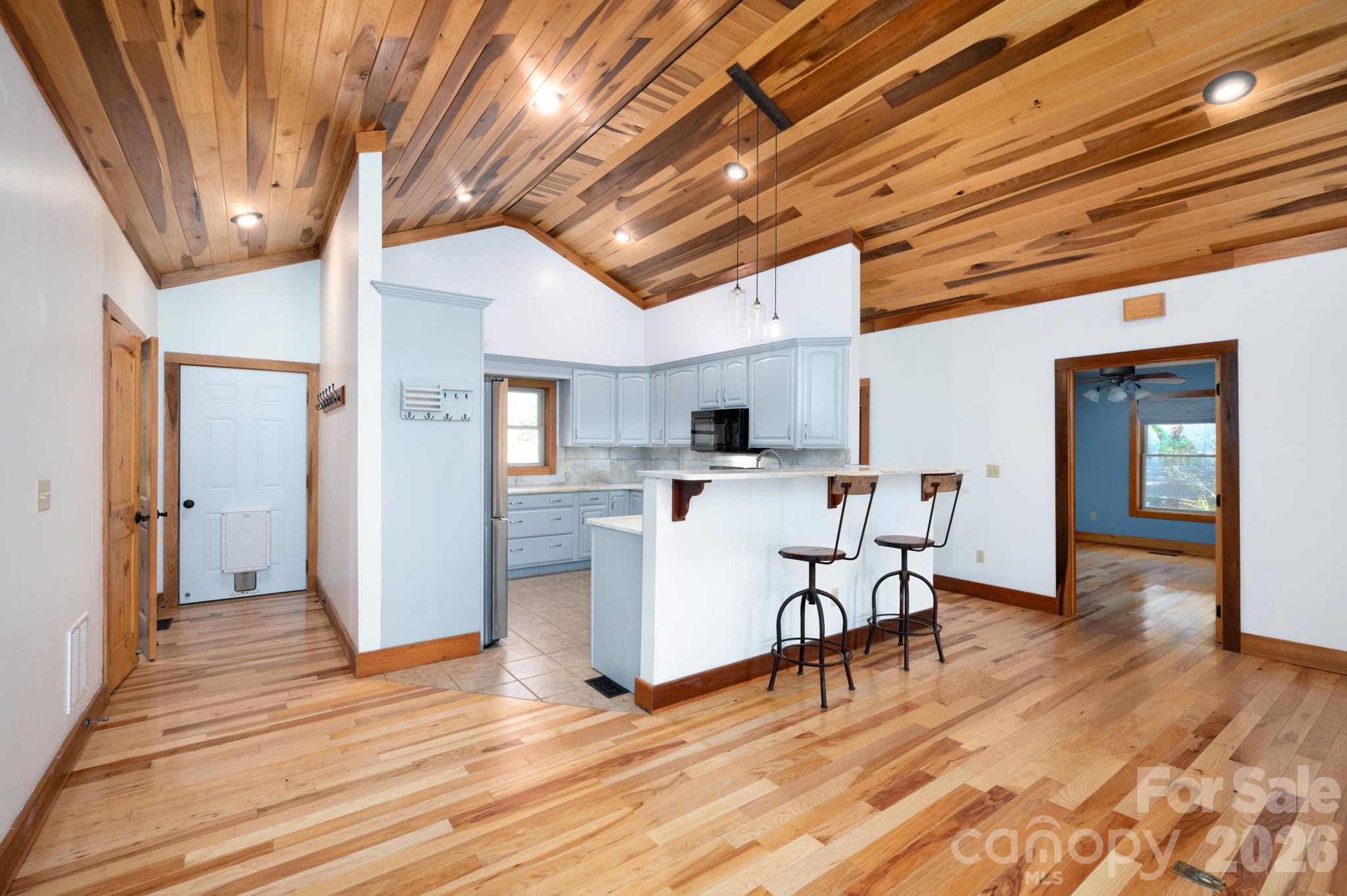 22 Faholoa Ridge Road Black Mountain, NC 28711 - Photo 12 of 47 a view of a dining room with furniture wooden floor and a chandelier