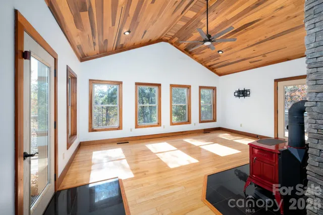 a living room with furniture rug and wooden floor