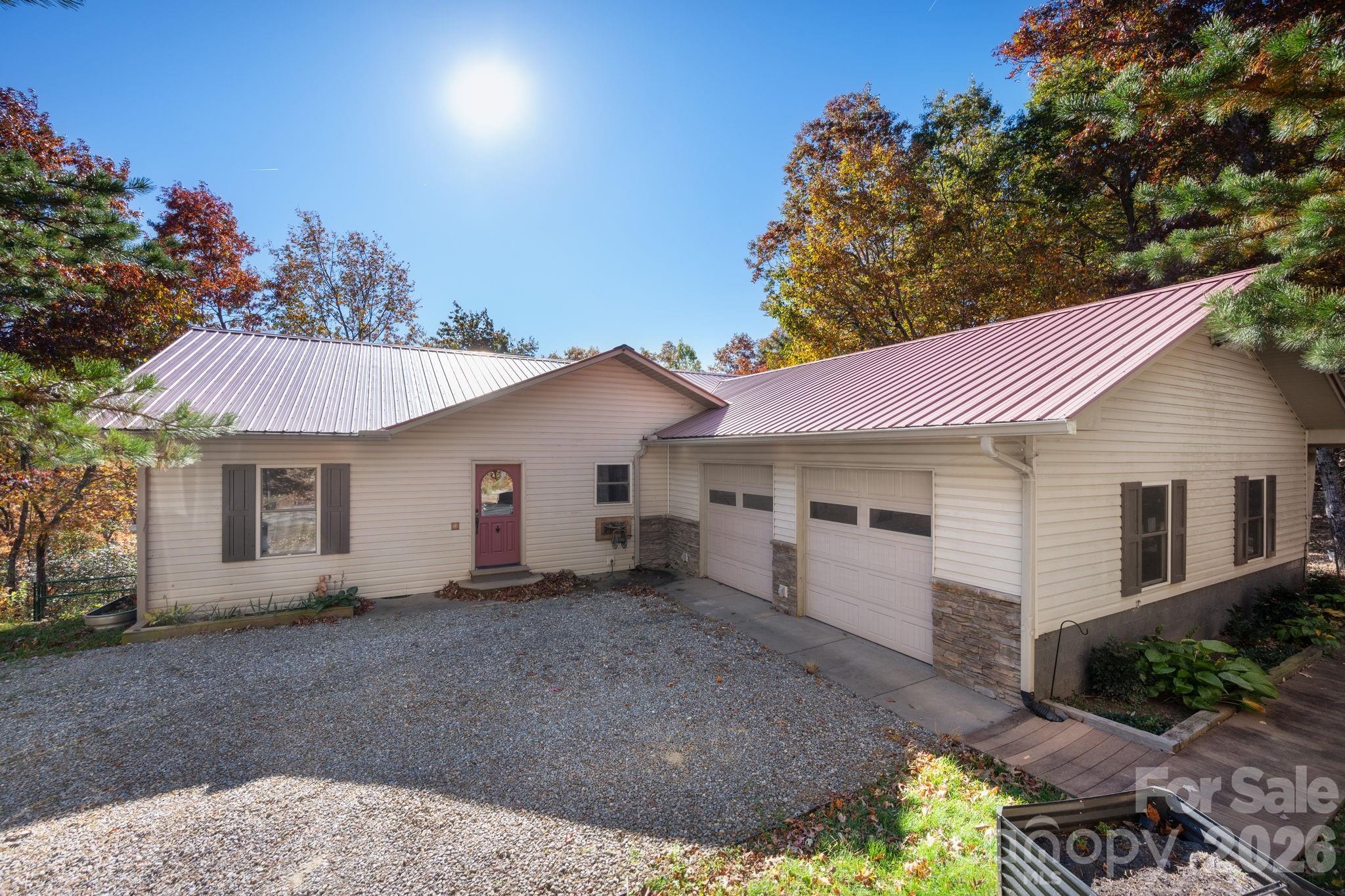 22 Faholoa Ridge Road Black Mountain, NC 28711 - Photo 2 of 47 a view of a house with a yard and potted plants
