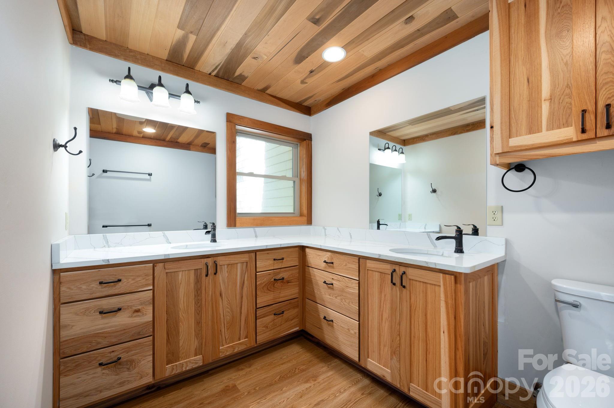 22 Faholoa Ridge Road Black Mountain, NC 28711 - Photo 26 of 47 a kitchen with a sink cabinets and wooden floor