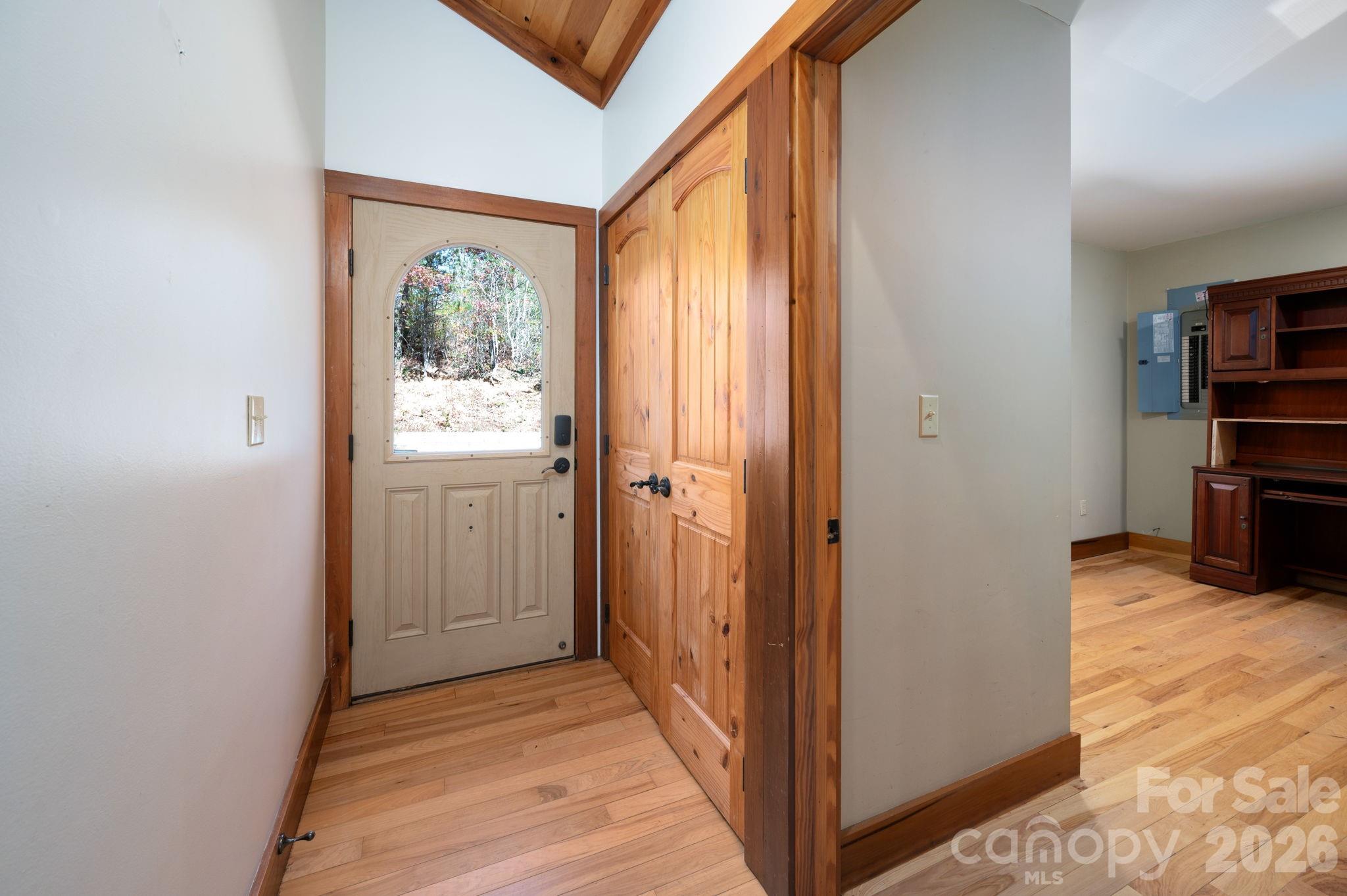 22 Faholoa Ridge Road Black Mountain, NC 28711 - Photo 28 of 47 a view of a hallway with wooden floor and a bathroom