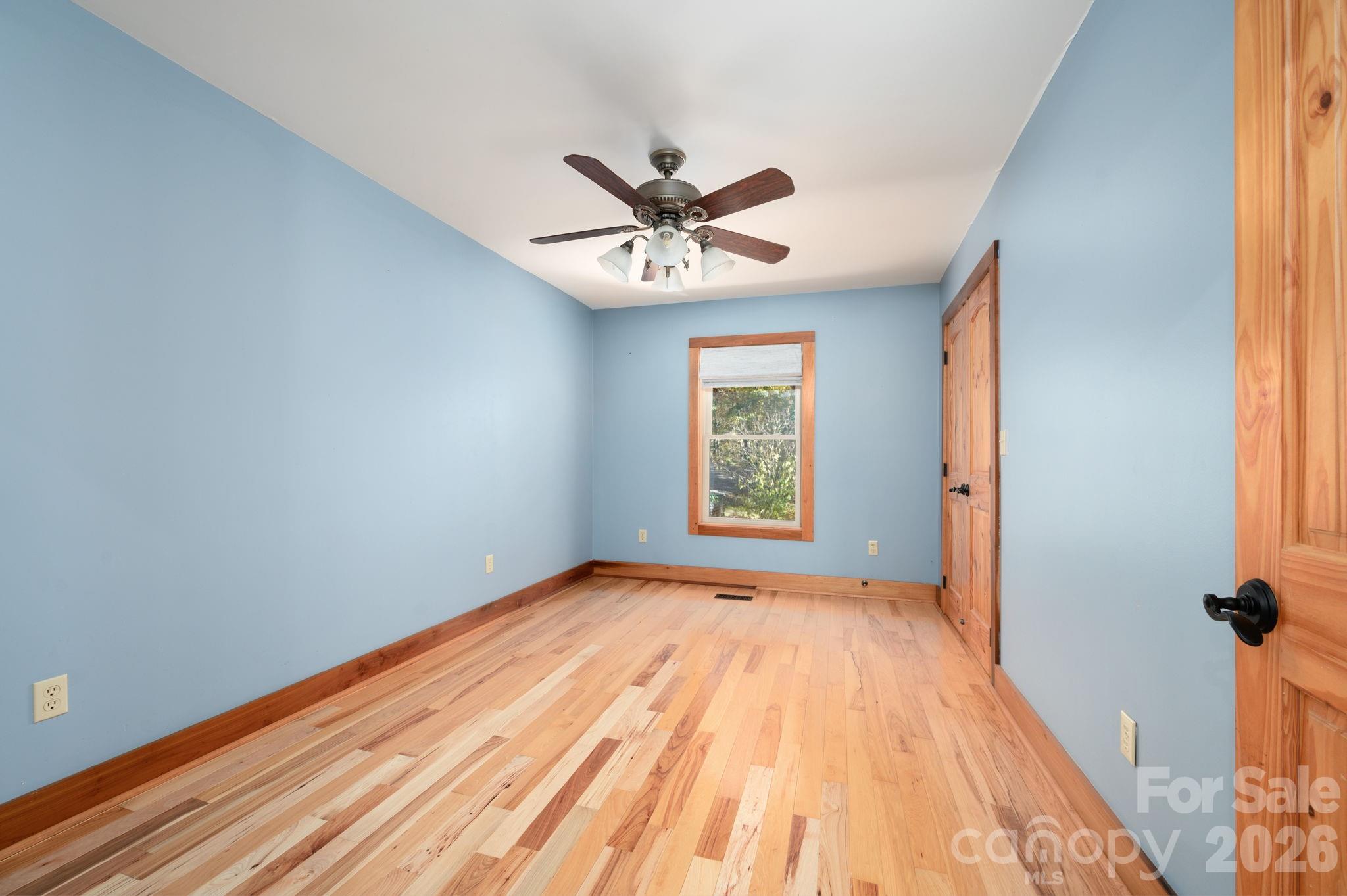 22 Faholoa Ridge Road Black Mountain, NC 28711 - Photo 29 of 47 wooden floor in an empty room with a window