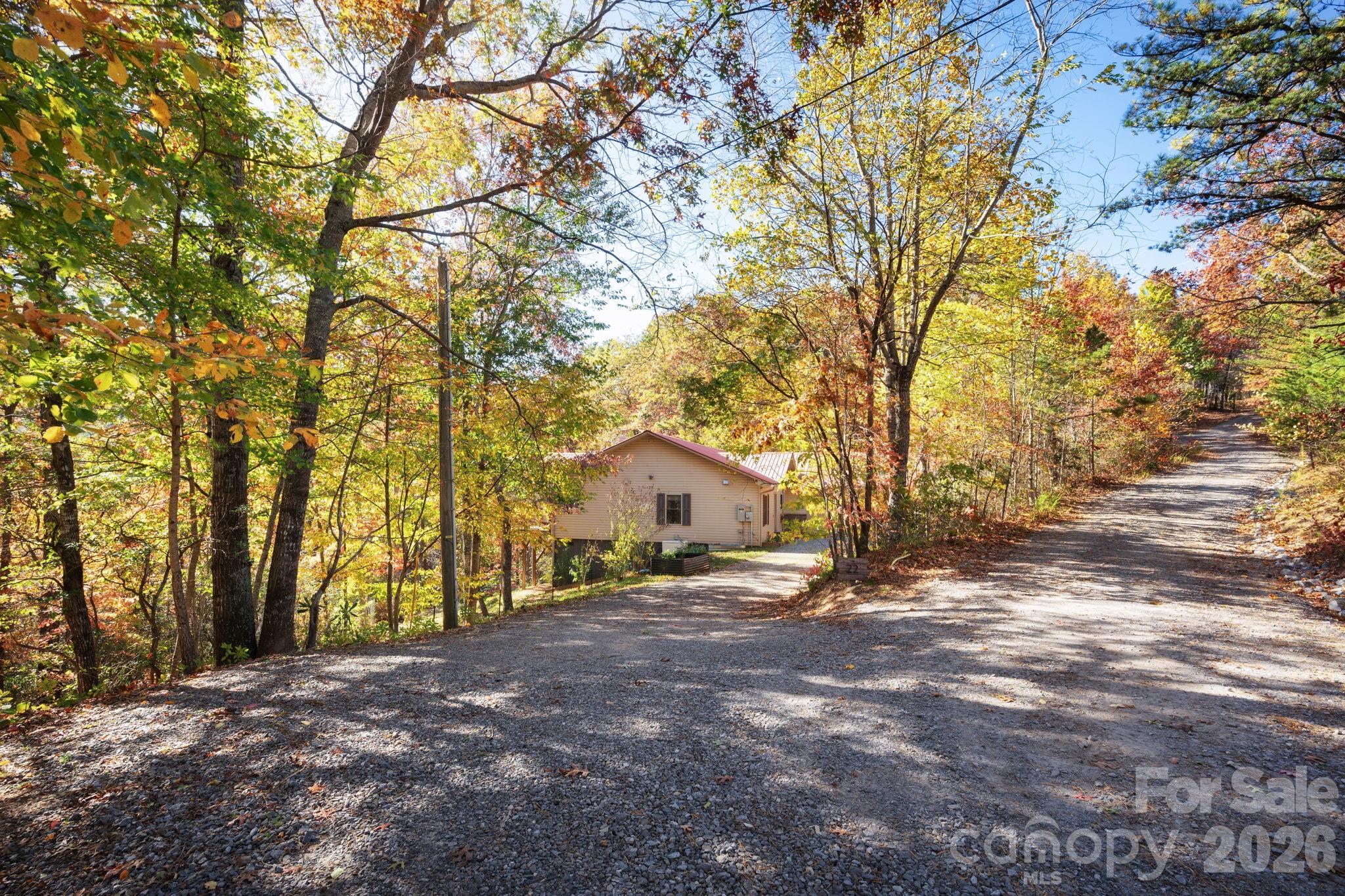 22 Faholoa Ridge Road Black Mountain, NC 28711 - Photo 43 of 47 a view of house with outdoor space and trees