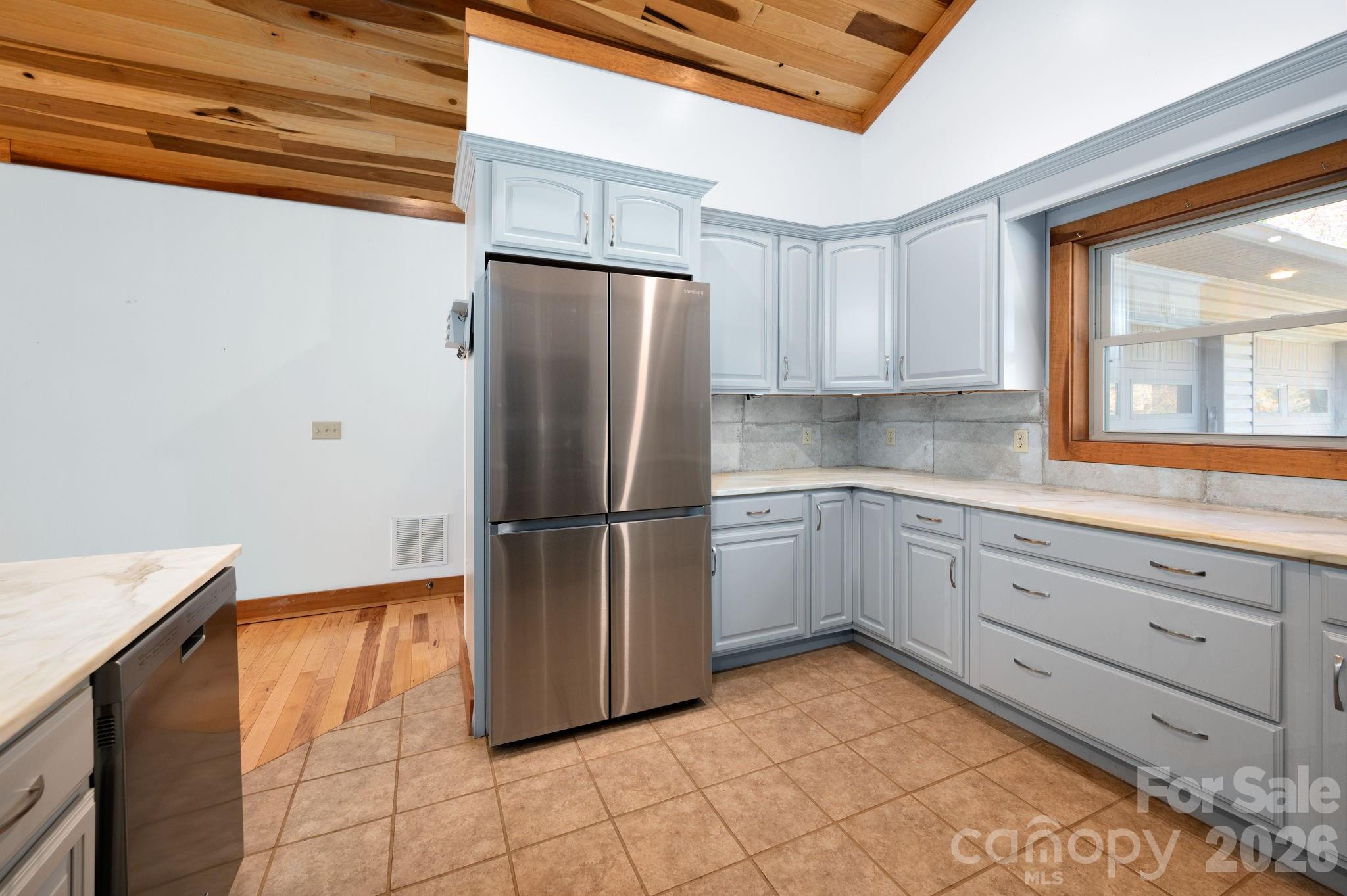 22 Faholoa Ridge Road Black Mountain, NC 28711 - Photo 6 of 47 a kitchen with a refrigerator sink and cabinets