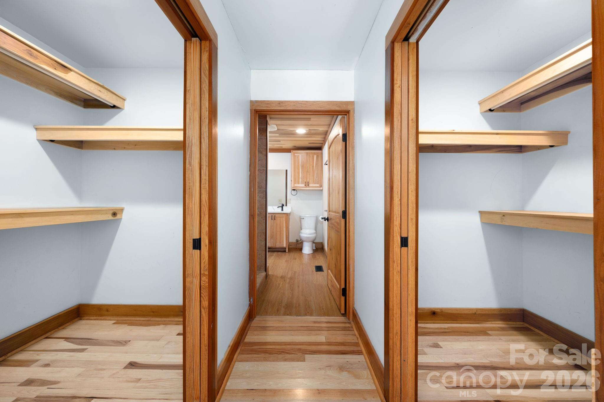 22 Faholoa Ridge Road Black Mountain, NC 28711 - Photo 10 of 47 a view of a hallway with wooden floor and staircase