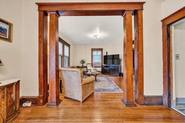 a view of living room with furniture and a fireplace