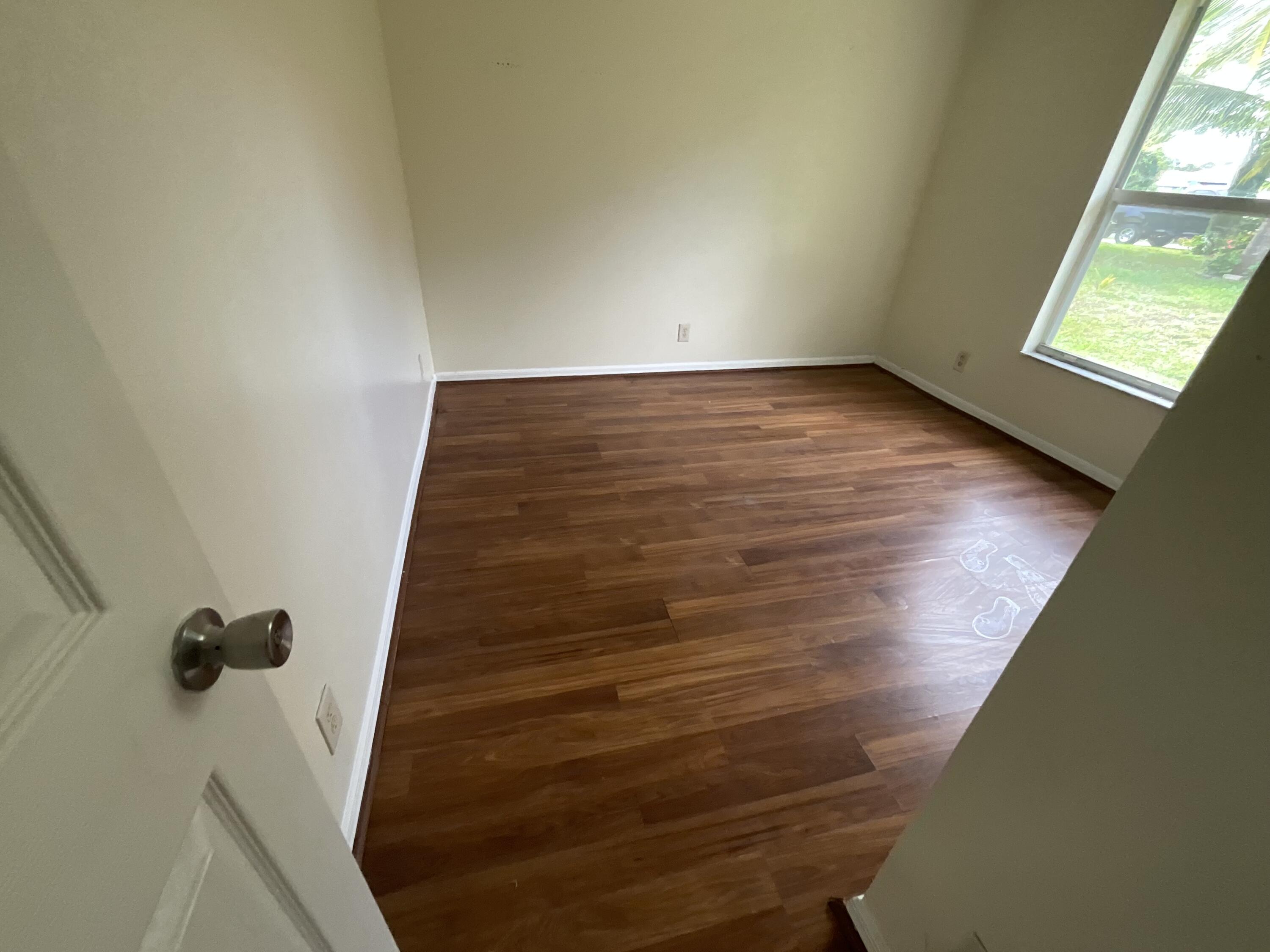 1002 Southwest Romaine Lane Port St. Lucie, FL 34953 - Photo 14 of 26 a view of an empty room with windows